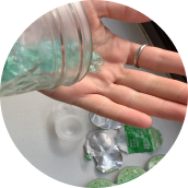 Illustration of man and woman recycling used lens materials